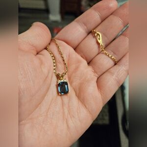 Gold tone necklace with blue stone and cz diamonds
